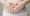 Plus size woman in underwear holding hands on abdominal area forming heart shape around navel