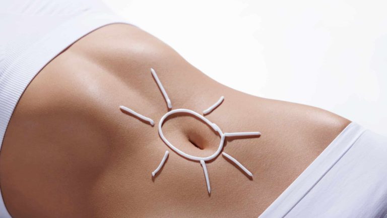 Image of sun on belly of woman